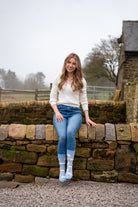 country girl modelling blue themed romney sheep socks 