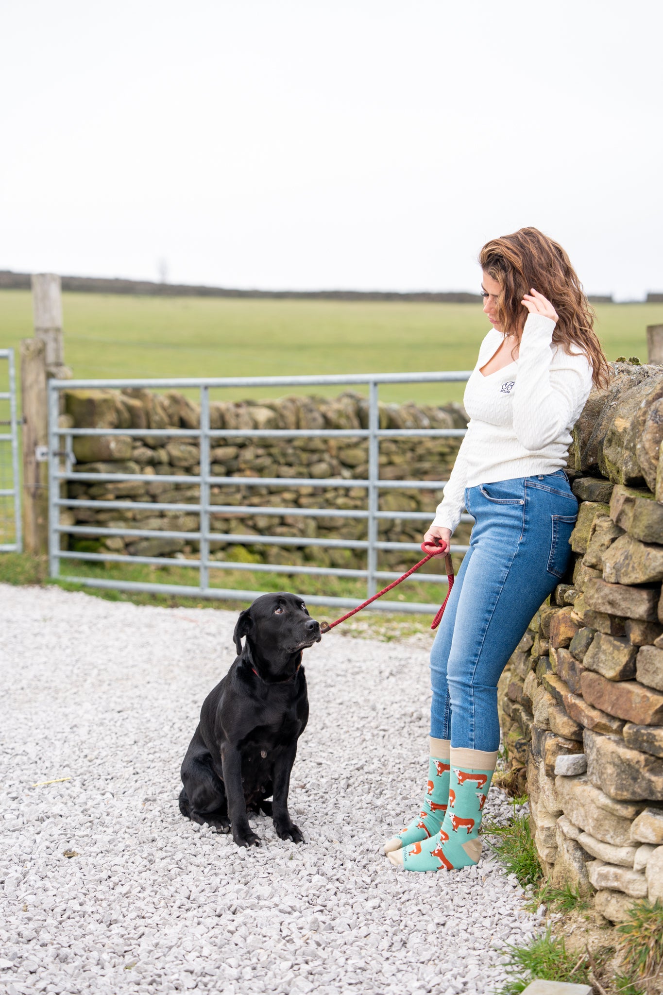 country girl modelling green themed cow socks
