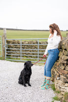 country girl modelling green themed cow socks