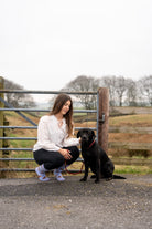 country girl modelling purple themed hedgehog socks 