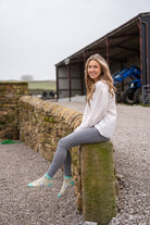 country girl modelling valais blacknose sheep ankle socks