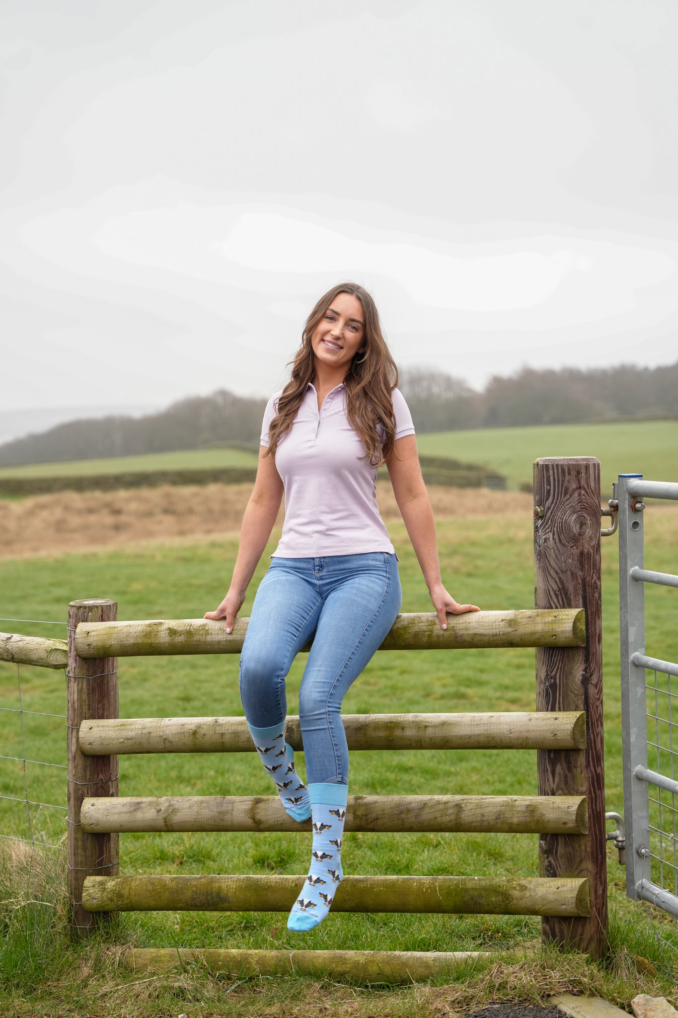 country girl wearing blue friesian cow socks