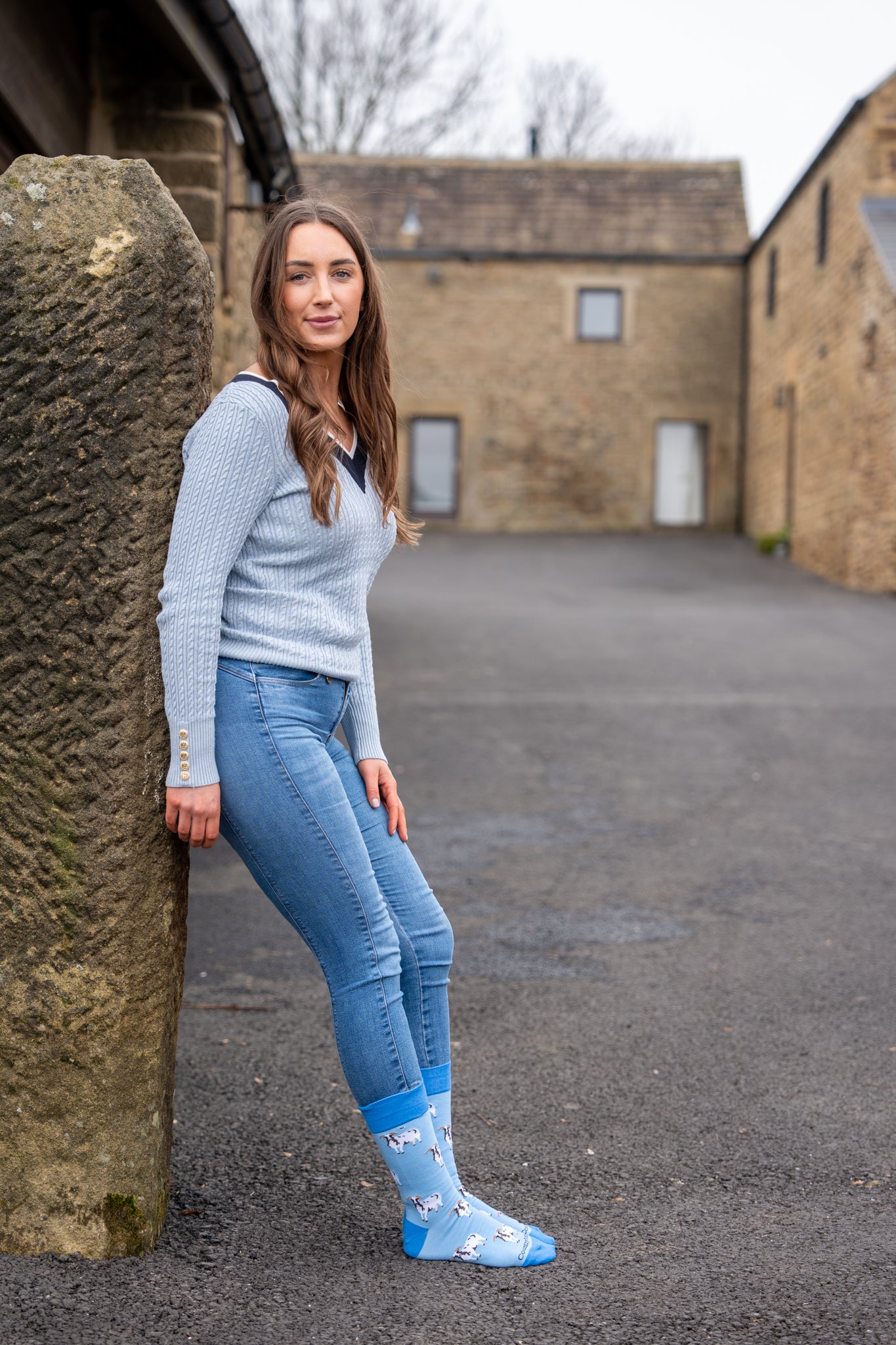 country girl wearing blue themed jacob sheep socks