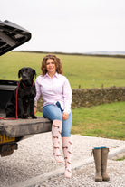 country girl wearing pink horse welly socks 