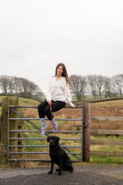 country girl wearing purple themed hedgehog crew socks