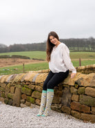 country girl wearing valais blacknose sheep welly socks 