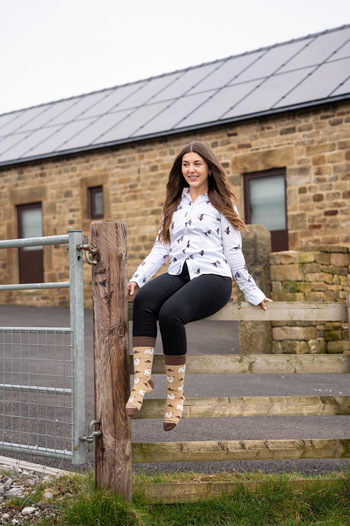 country girl wearing western themed cow socks 
