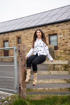 country girl wearing western themed cow socks 