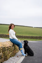 country girl with her dog wearing goat socks