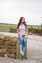 country model wearing blue friesian cow socks