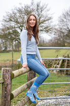 country model wearing blue themed jacob sheep socks