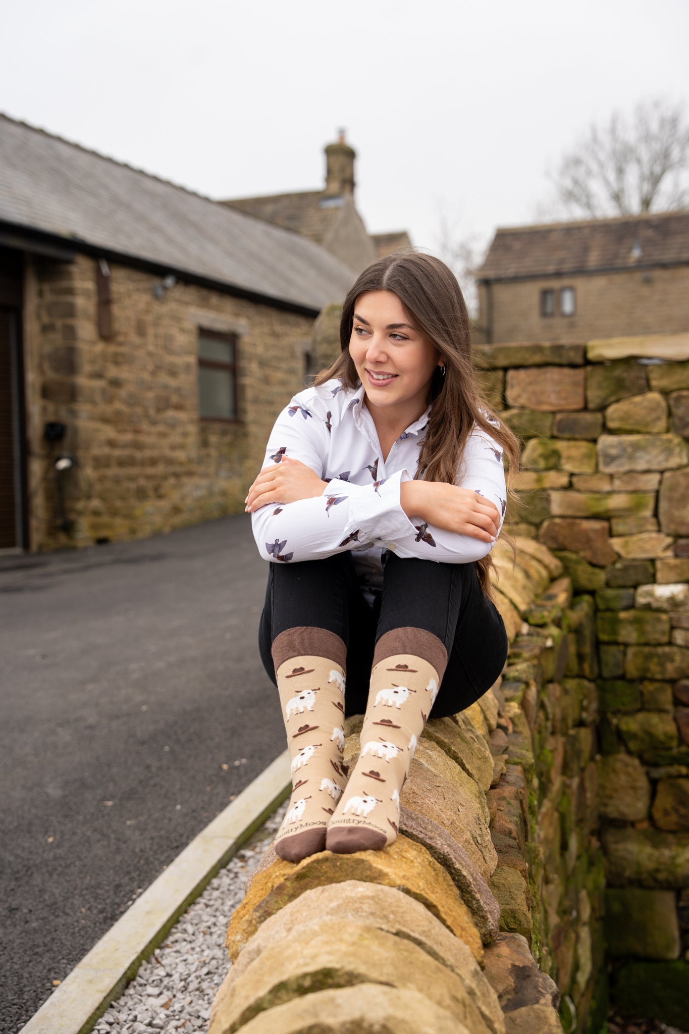 country model wearing western cow socks 