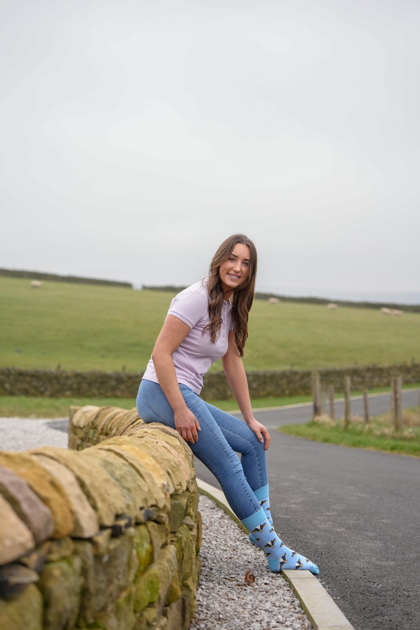 model wearing blue friesian cow socks