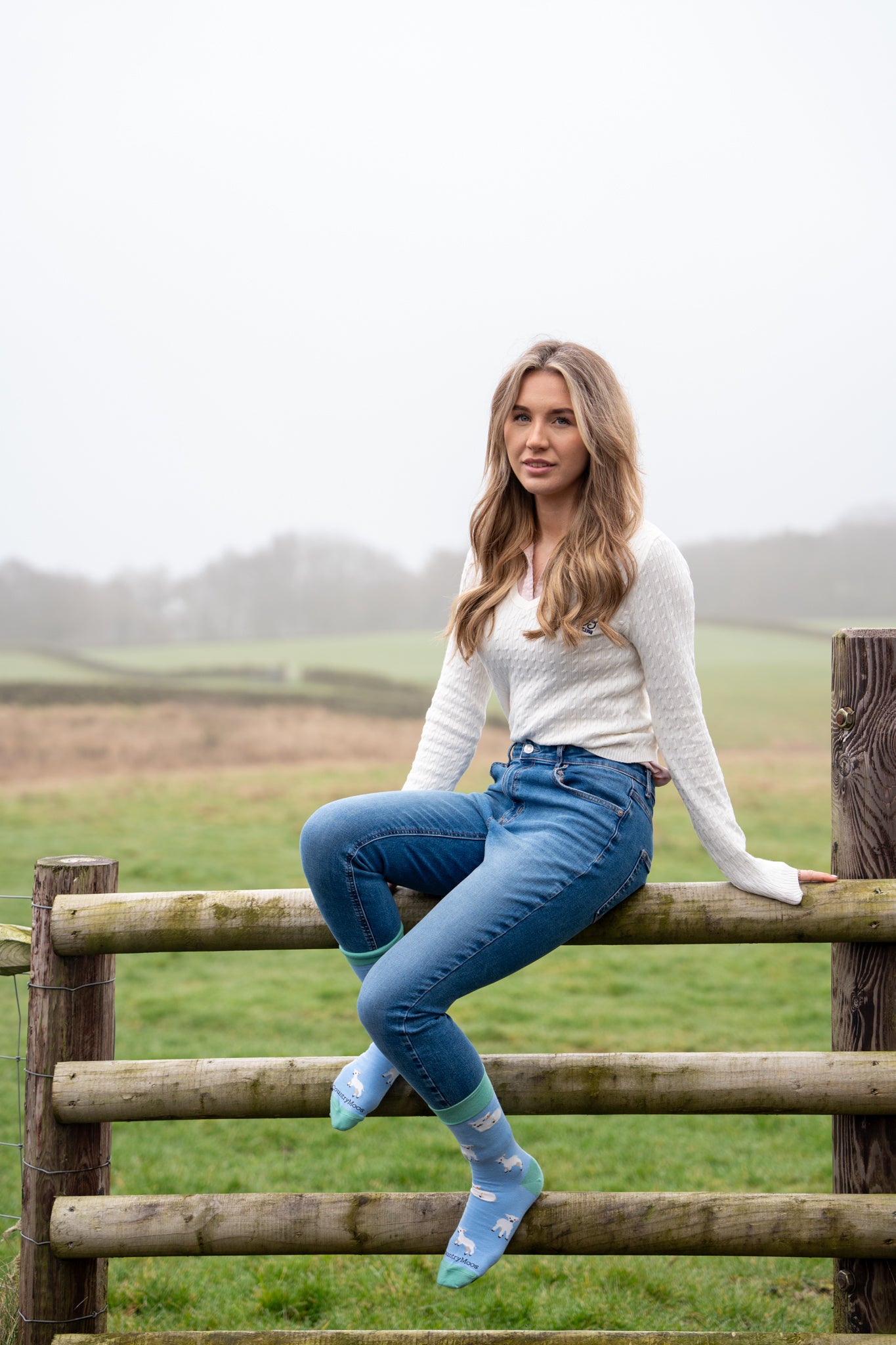 model wearing blue themed lamb sheep socks 