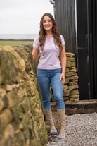 model wearing dairy cow welly socks