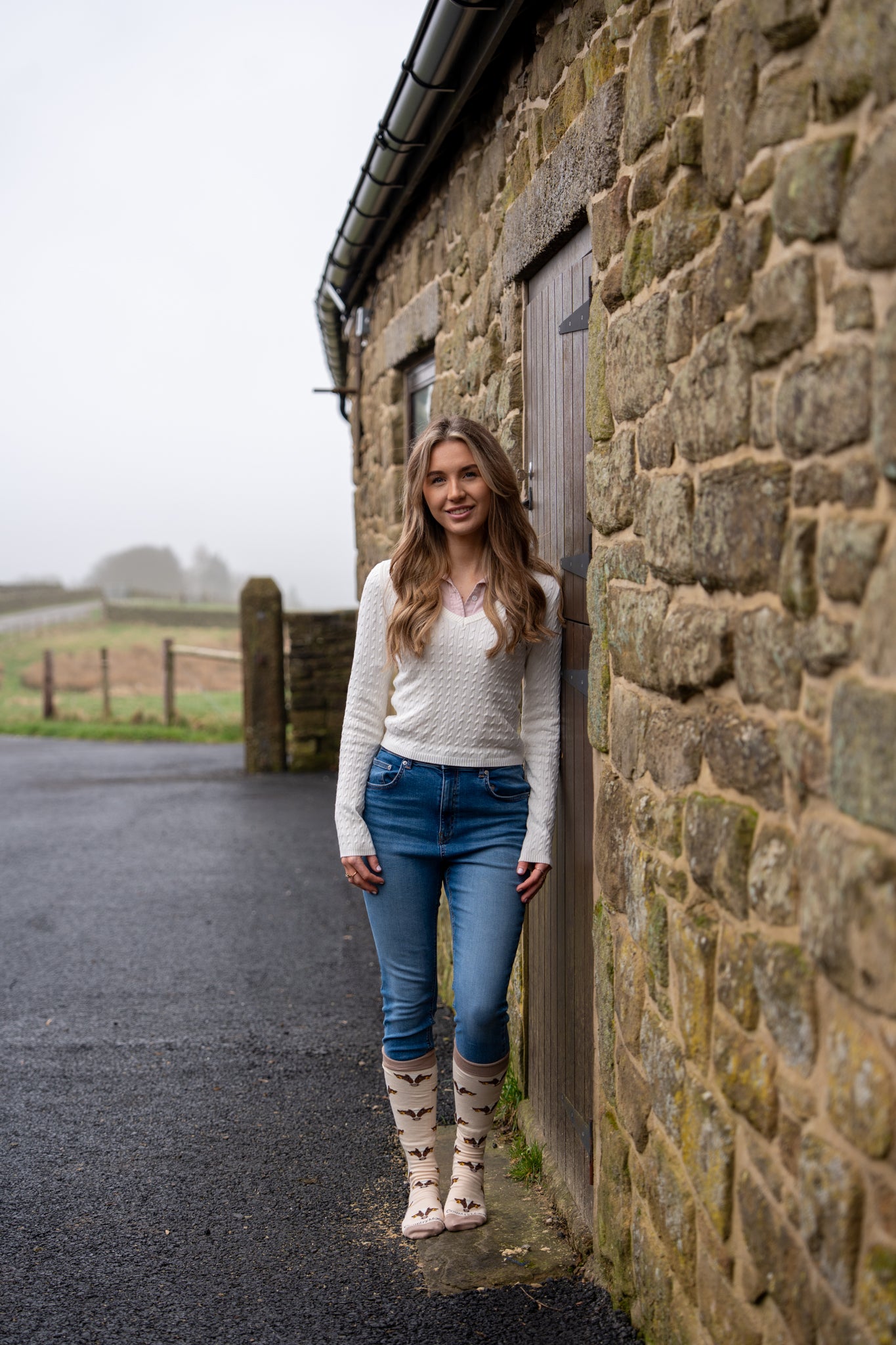 model wearing friesian cow welly socks