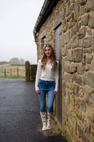 model wearing friesian cow welly socks