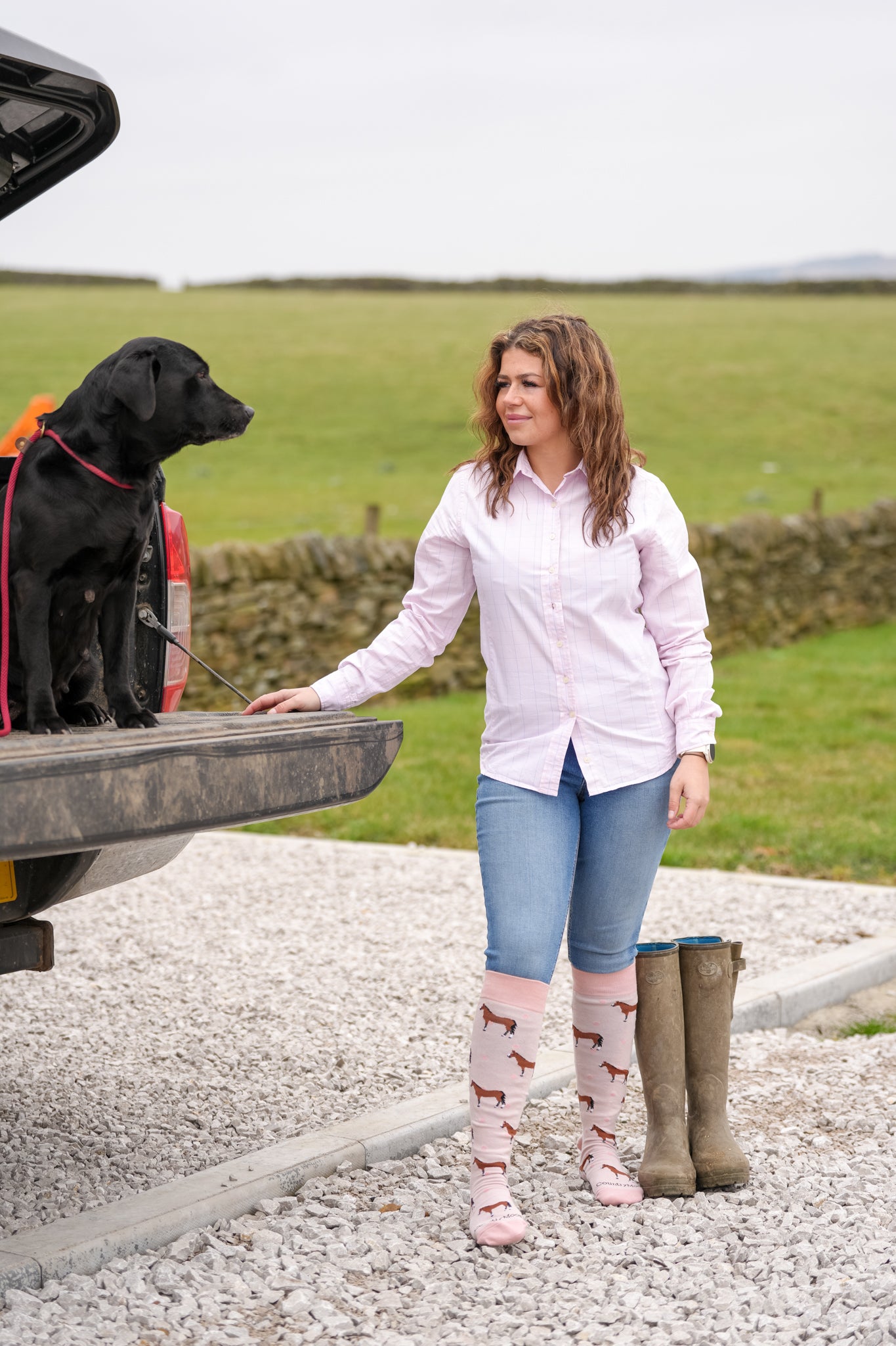 model wearing pink horse welly socks 
