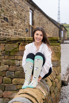 model wearing valais blacknose sheep welly socks