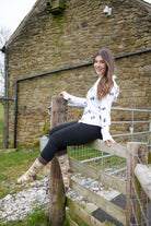 model wearing western texas themed cow socks 